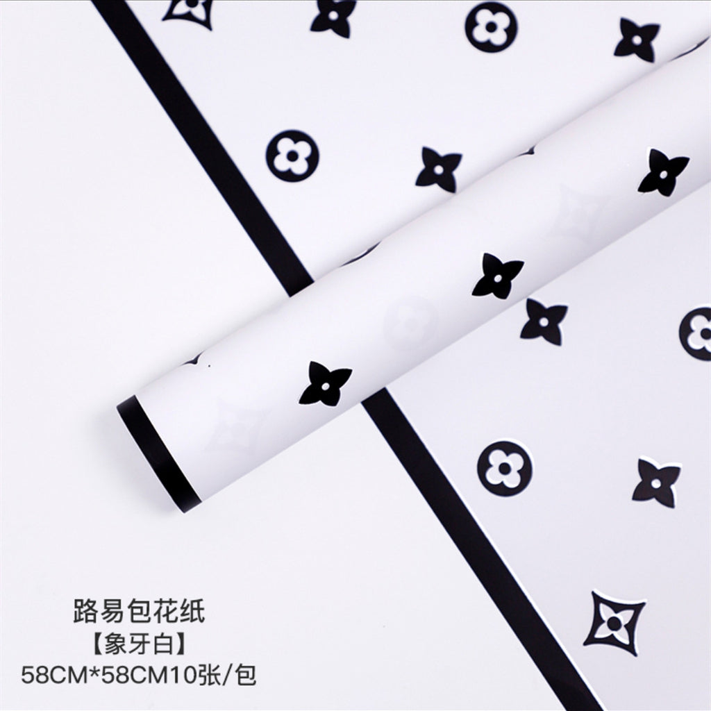 Manufacturer wholesale fashion simple flower wrapping paper light luxury creative four-leaf clover high-end flower shop floral material package flower paper