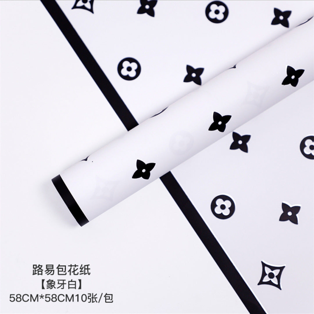 Manufacturer wholesale fashion simple flower wrapping paper light luxury creative four-leaf clover high-end flower shop floral material package flower paper