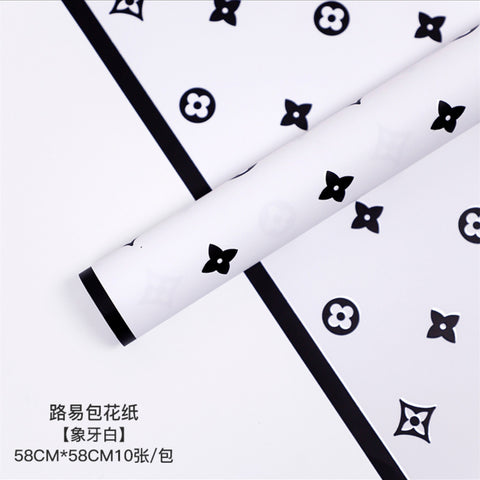 Manufacturer wholesale fashion simple flower wrapping paper light luxury creative four-leaf clover high-end flower shop floral material package flower paper