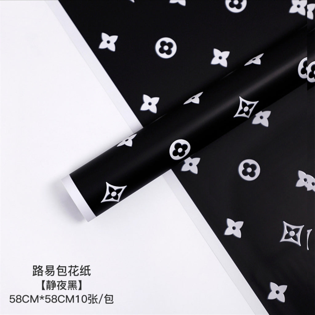 Manufacturer wholesale fashion simple flower wrapping paper light luxury creative four-leaf clover high-end flower shop floral material package flower paper