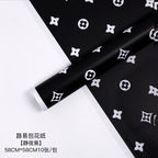 Manufacturer wholesale fashion simple flower wrapping paper light luxury creative four-leaf clover high-end flower shop floral material package flower paper