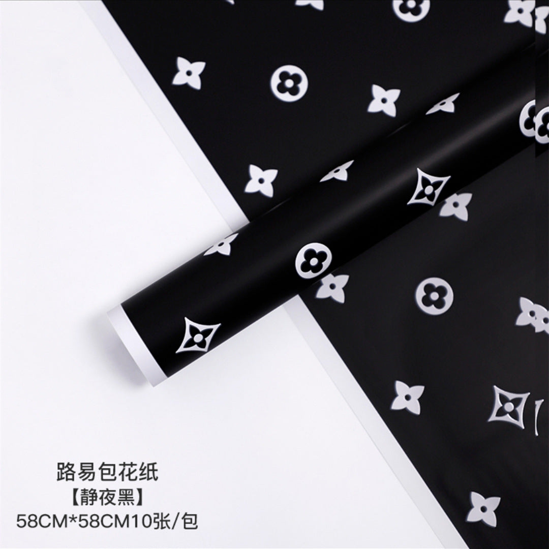 Manufacturer wholesale fashion simple flower wrapping paper light luxury creative four-leaf clover high-end flower shop floral material package flower paper