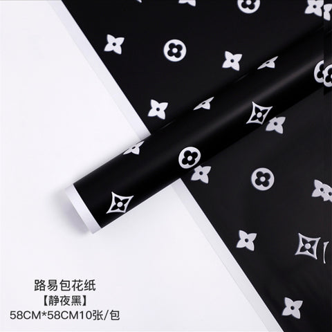 Manufacturer wholesale fashion simple flower wrapping paper light luxury creative four-leaf clover high-end flower shop floral material package flower paper