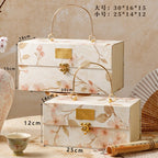 Oil painting bronzing Chinese relief advanced light luxury happy candy box with hand gift custom portable gift box red fabric source manufacturer