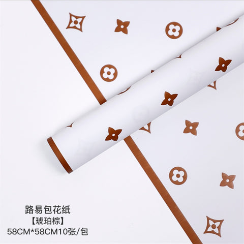 Manufacturer wholesale fashion simple flower wrapping paper light luxury creative four-leaf clover high-end flower shop floral material package flower paper