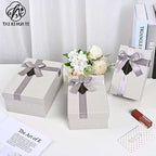 Customized Portable Pink Square Paper Gift Box with UV Coating Bow Mug Set Pen Wine Lid